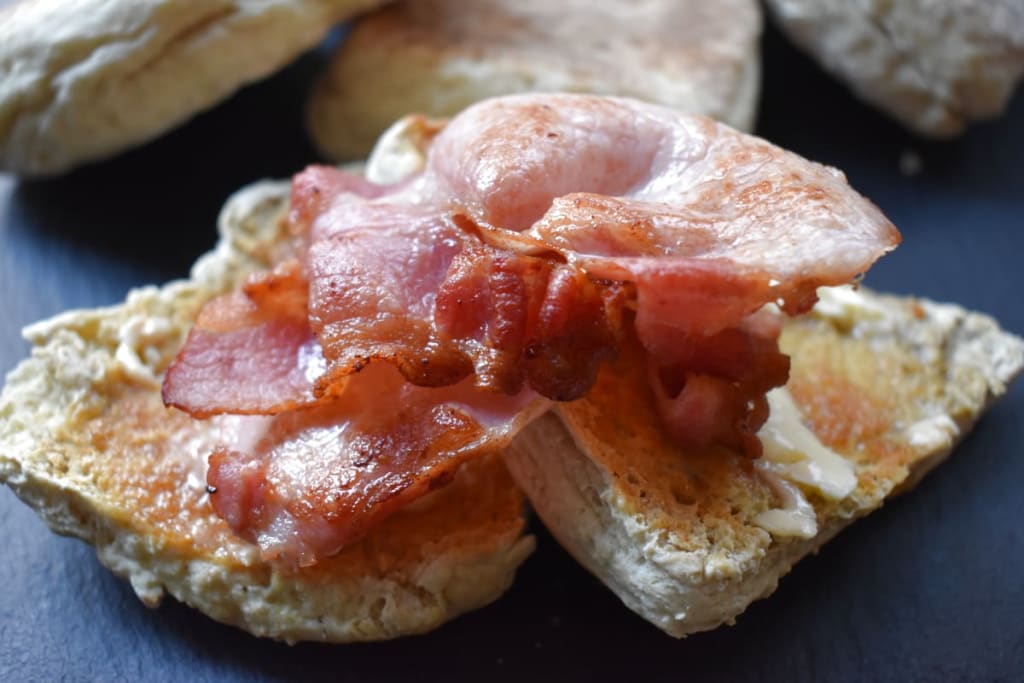 Soda Bread Farls cut in half, buttered and topped with bacon
